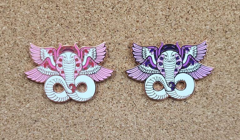 Pink and purple angelic Egyptian cobra enamel pins